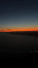 Airplane passenger captures sunset view over Gavà, Spain