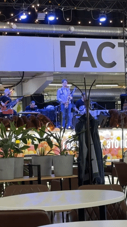 Band performs live music in food court setting