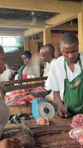 Lagos market life: butchers, vendors, and goods on the move