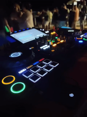 Nighttime beach party with live DJ set in Kuşadası, Turkey