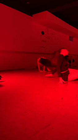 Women attend dance class at Moscow studio with red lighting