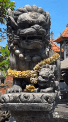 Weathered statues and temple gates at a Blahbatuh compound