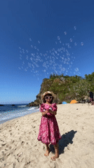 Families enjoy beach day with bubble play in Indonesia