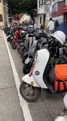 Photoshoot and parked scooters documented in Liwan District
