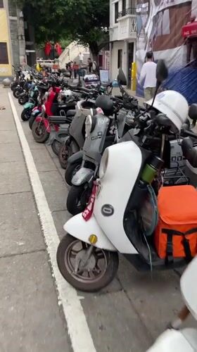 Photoshoot and parked scooters documented in Liwan District