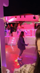 Outdoor nightlife venue with DJ and fashion exhibit in Dénia