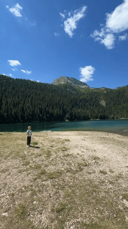 Morning at a Montenegrin lake, trails through pine forest