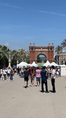 Weekend crowds gather around Barcelona's Arc de Triomf plaza