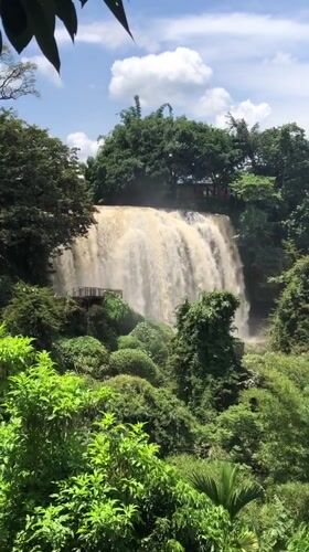 Muddy waterfall and temple details from central Vietnam highlands