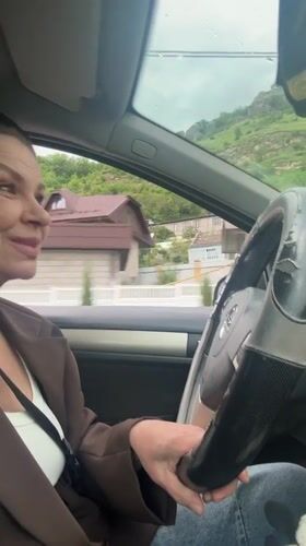 Woman drives past mosque in Karachayevsk, Russia