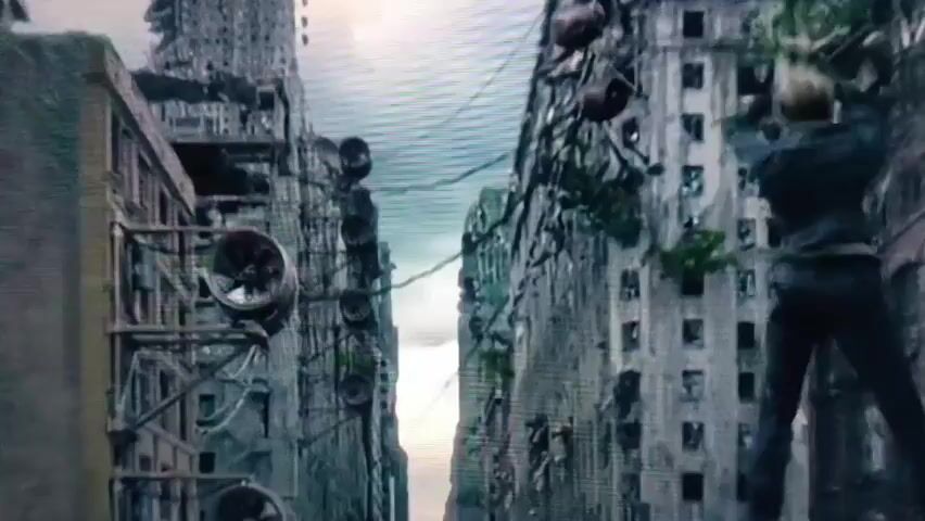 A person is falling through the air, with a ruined city skyline in the background. The person is wearing dark clothing and appears to be in mid-air, with their arms and legs flailing. Buildings on either side of the person are heavily damaged, with debris and overgrown vegetation visible. A wire or cable is visible in the air above the person, suggesting they may have fallen from a height or were involved in some sort of aerial activity. The overall scene depicts a chaotic and destructive environment.