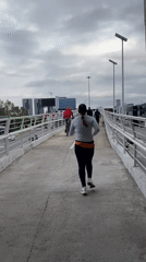 Woman jogs on overpass in Tlaxcalancingo, Mexico