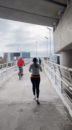 Woman jogs on overpass in Tlaxcalancingo, Mexico