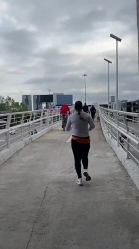 Woman jogs on overpass in Tlaxcalancingo, Mexico