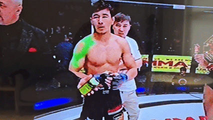 Fighter stands during post-fight ceremony at Khimki MMA arena