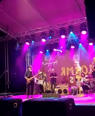 Live band performance at outdoor evening event in Yambol