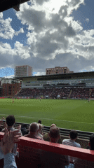 Soccer match observed from London stadium stands