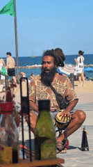 Street musicians perform on sunny Barcelona beach promenade