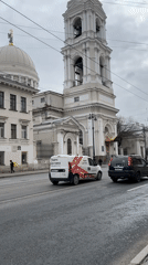 Morning street activity documented around Orthodox church in Saint Petersburg