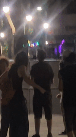 Nighttime hangout scene on the streets of Marseille