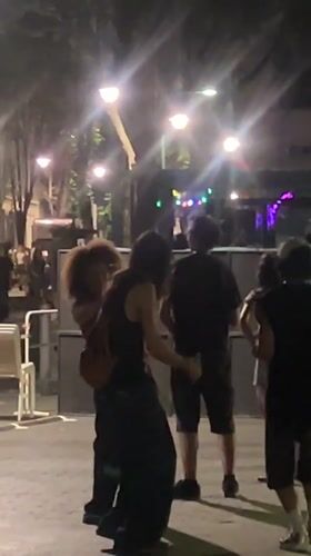 Nighttime hangout scene on the streets of Marseille