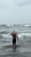Morning beach activities observed in North Kuta under cloudy skies