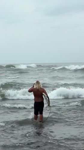 Morning beach activities observed in North Kuta under cloudy skies