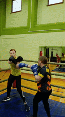 Women spar in boxing ring at Russian training facility
