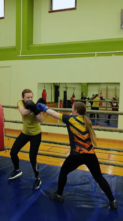 Women spar in boxing ring at Russian training facility