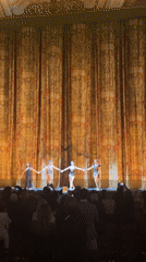 Stage curtain call with five performers in Moscow