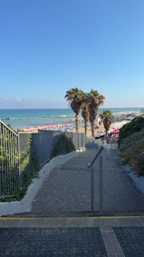 Morning beach scene at Bat Yam's shoreline