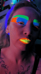 Person in fluorescent makeup photographed in Noviy, Russia