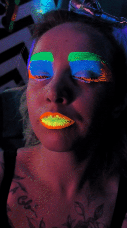 Person in fluorescent makeup photographed in Noviy, Russia
