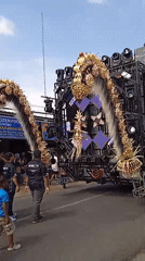 Traditional cultural procession with puppets parades through Winong Indonesia