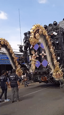 Traditional cultural procession with puppets parades through Winong Indonesia