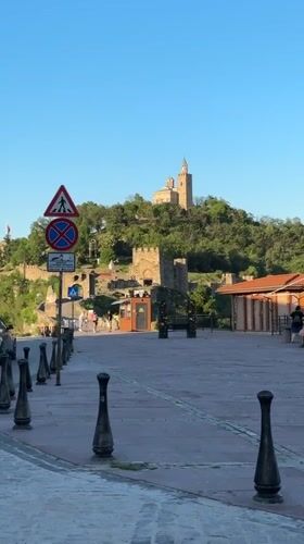 Tourists visit medieval fortress plaza in Veliko Tarnovo