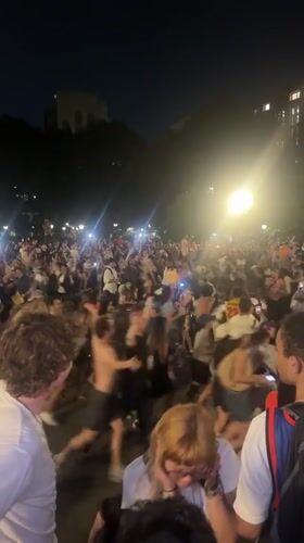 Late night crowd gathering and movement in New York