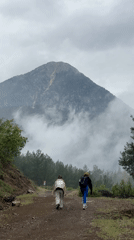 Two people walk dirt road in Konyaaltı, Turkey