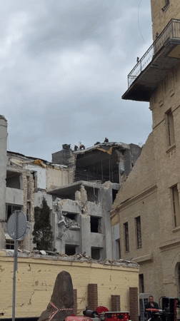 Building damaged in Kyiv, emergency responders on scene