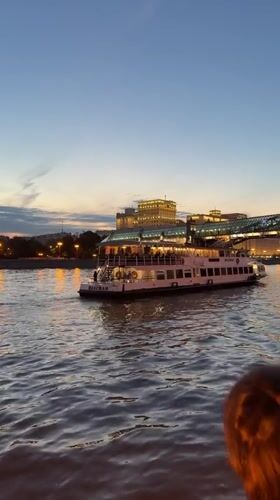 Midsummer evening dancing along the Moscow River at dusk