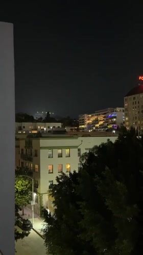 Hollywood Sign captured in nighttime footage from LA rooftop