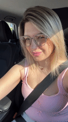 Woman in pink tank top drives through Sochi
