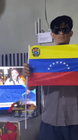 Man waves Venezuelan flag, captured in multiple moments in Juangriego