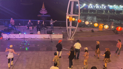 Nighttime waterfront concert draws dancers at North Jakarta Baywalk