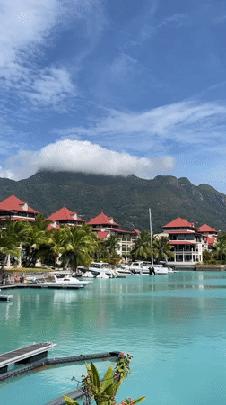 Quiet waterfront pier and docked boats in Seychelles