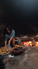 Late-night frying and excavator work in rural Gondang