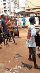 Unpaved streets documented in Onitsha, Nigeria during afternoon hours