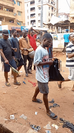 Unpaved streets documented in Onitsha, Nigeria during afternoon hours