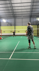 Indoor badminton match in full swing at Kuta Selatan court