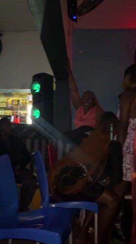 Evening crowd inside a Jos bar, August 2026